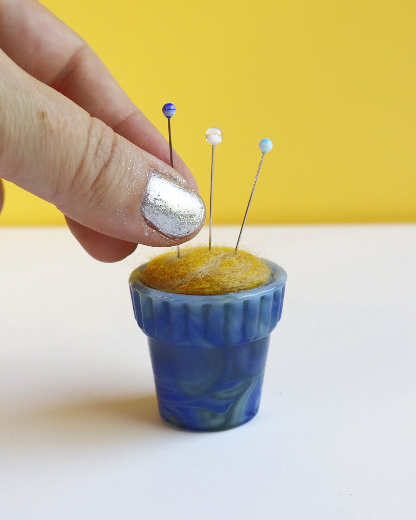 Itty bitty marbled glass and wool pin cushion