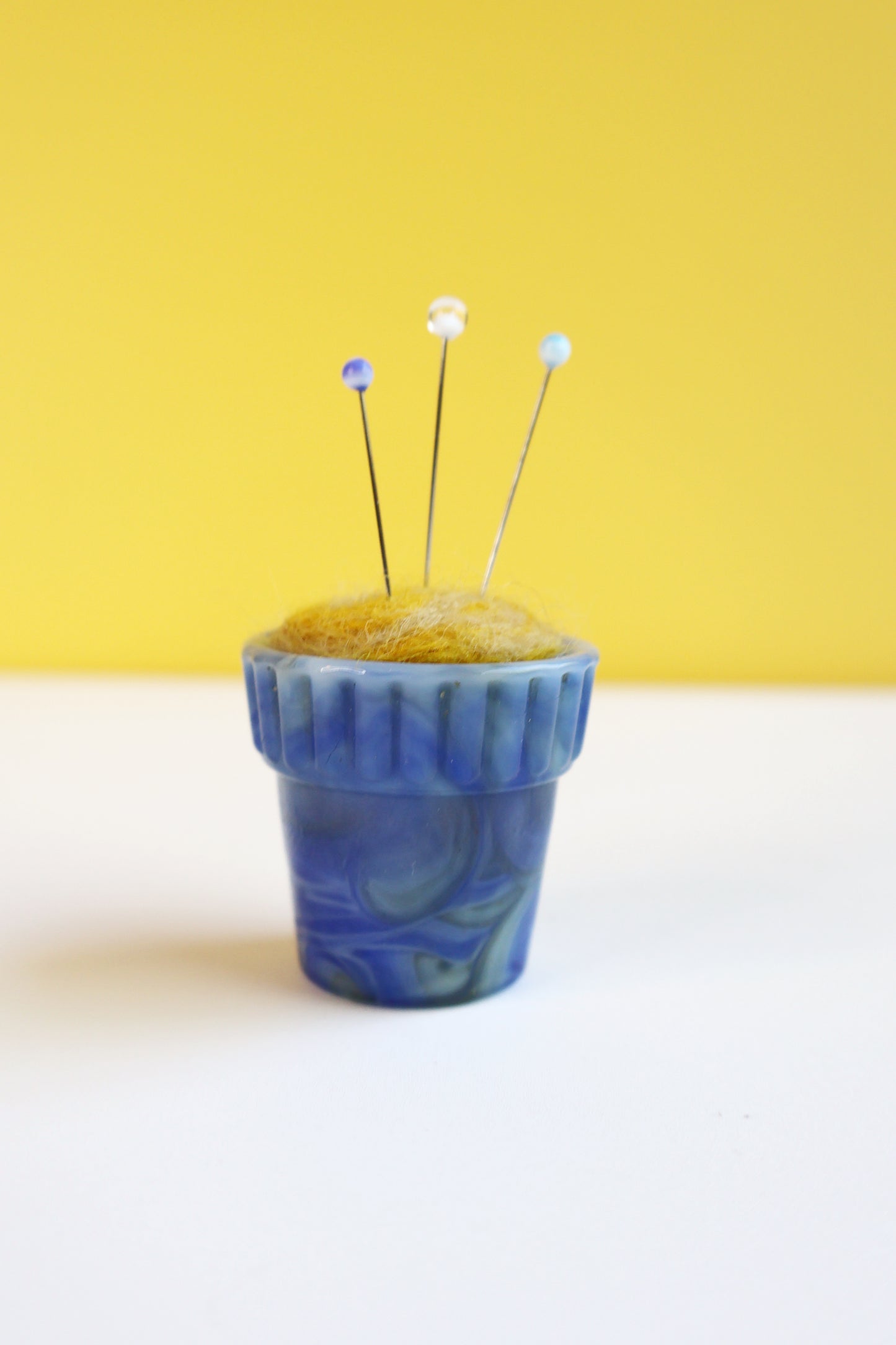 Itty bitty marbled glass and wool pin cushion
