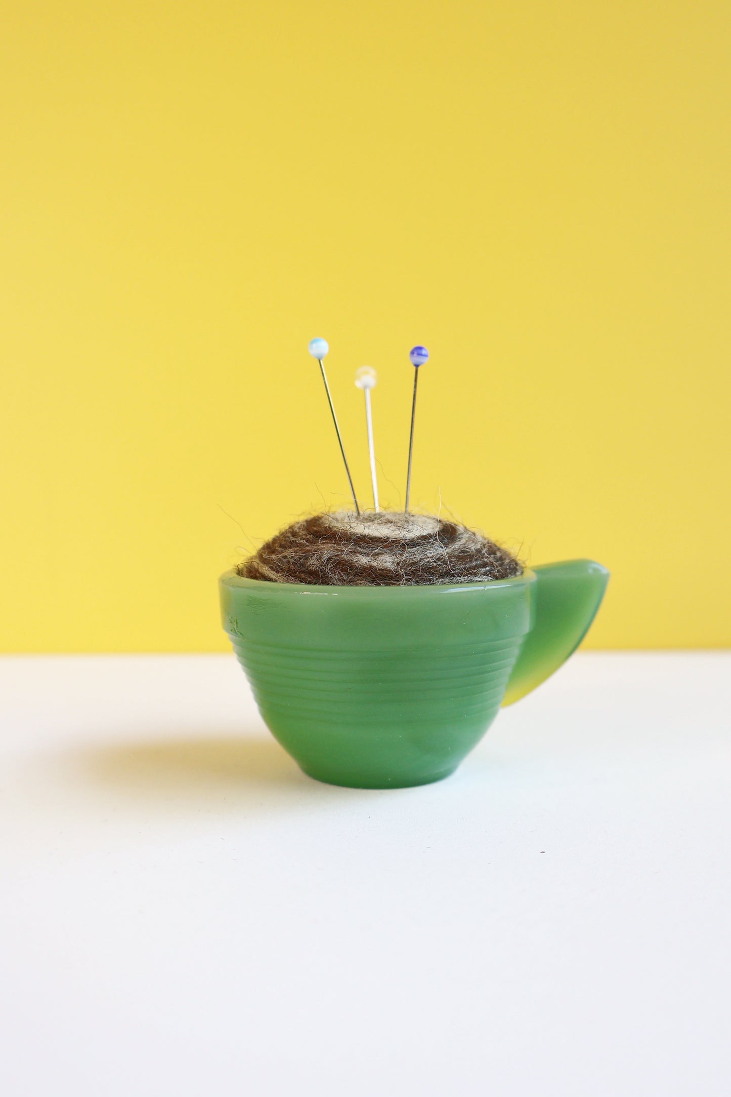 Marbled glass and wool pin cushion