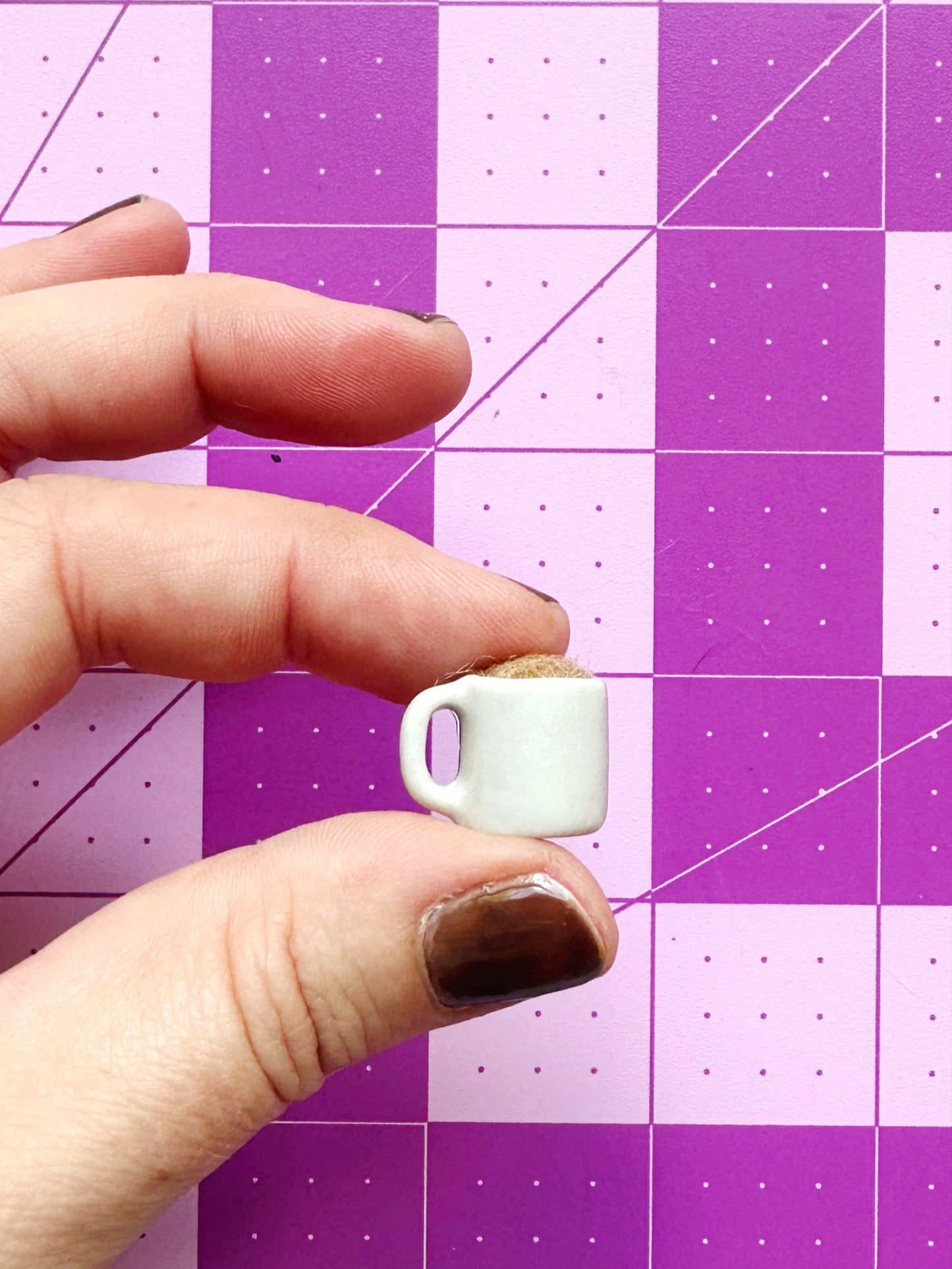 Coffee mug pin catcher
