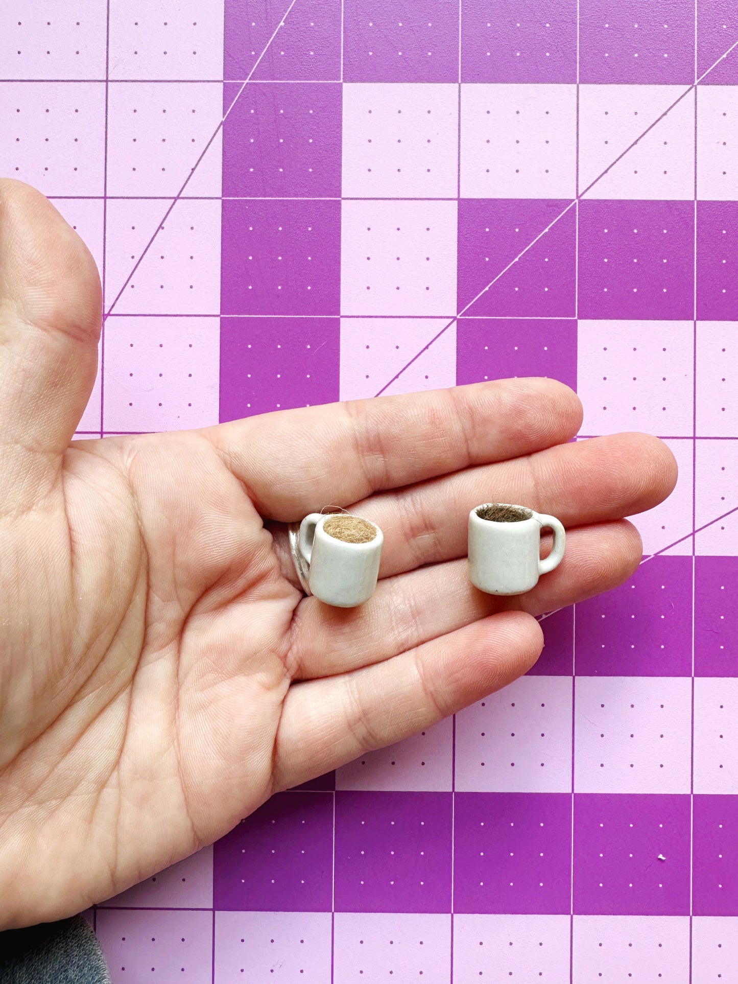Coffee mug pin catcher