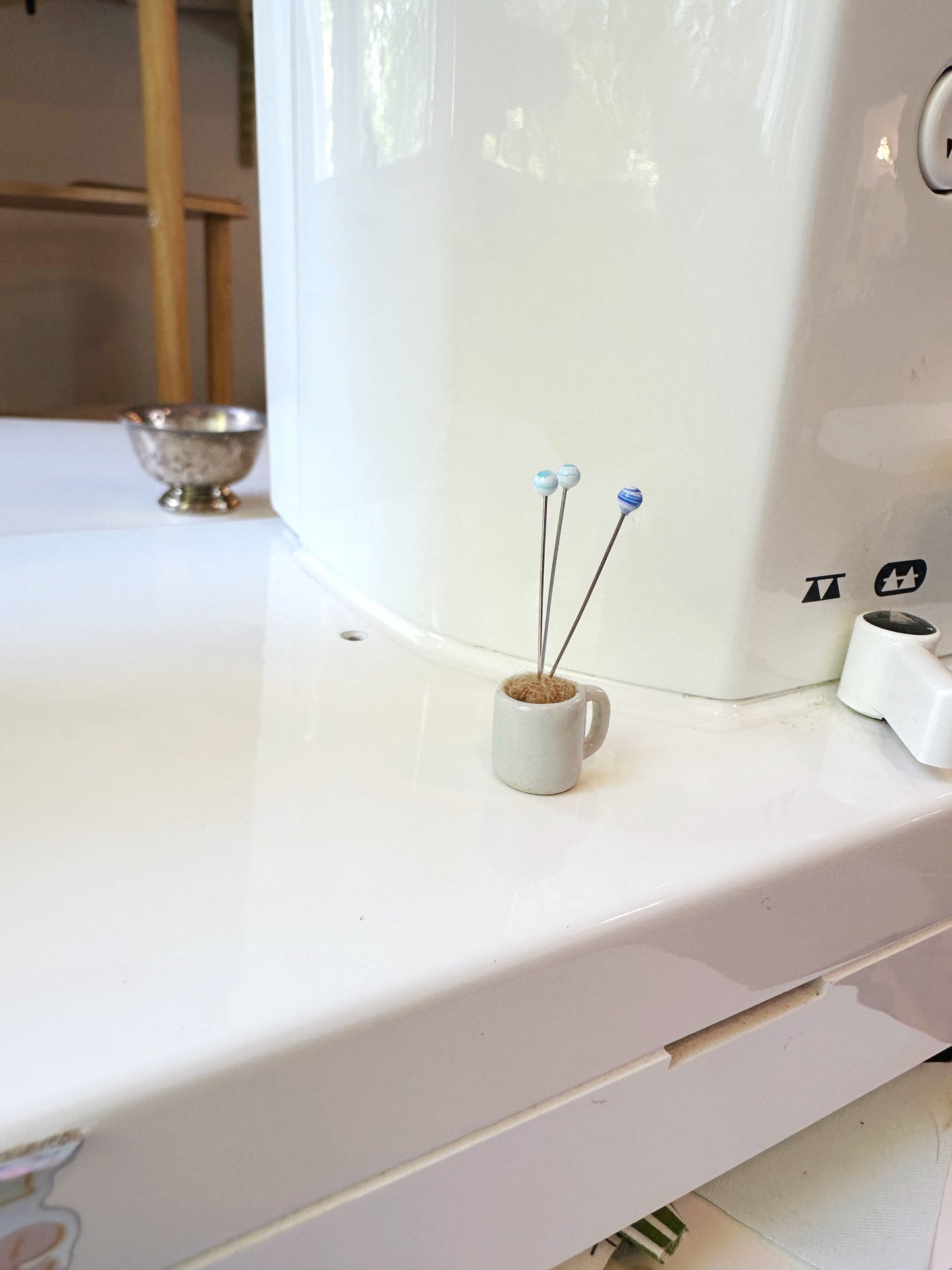 Coffee mug pin catcher
