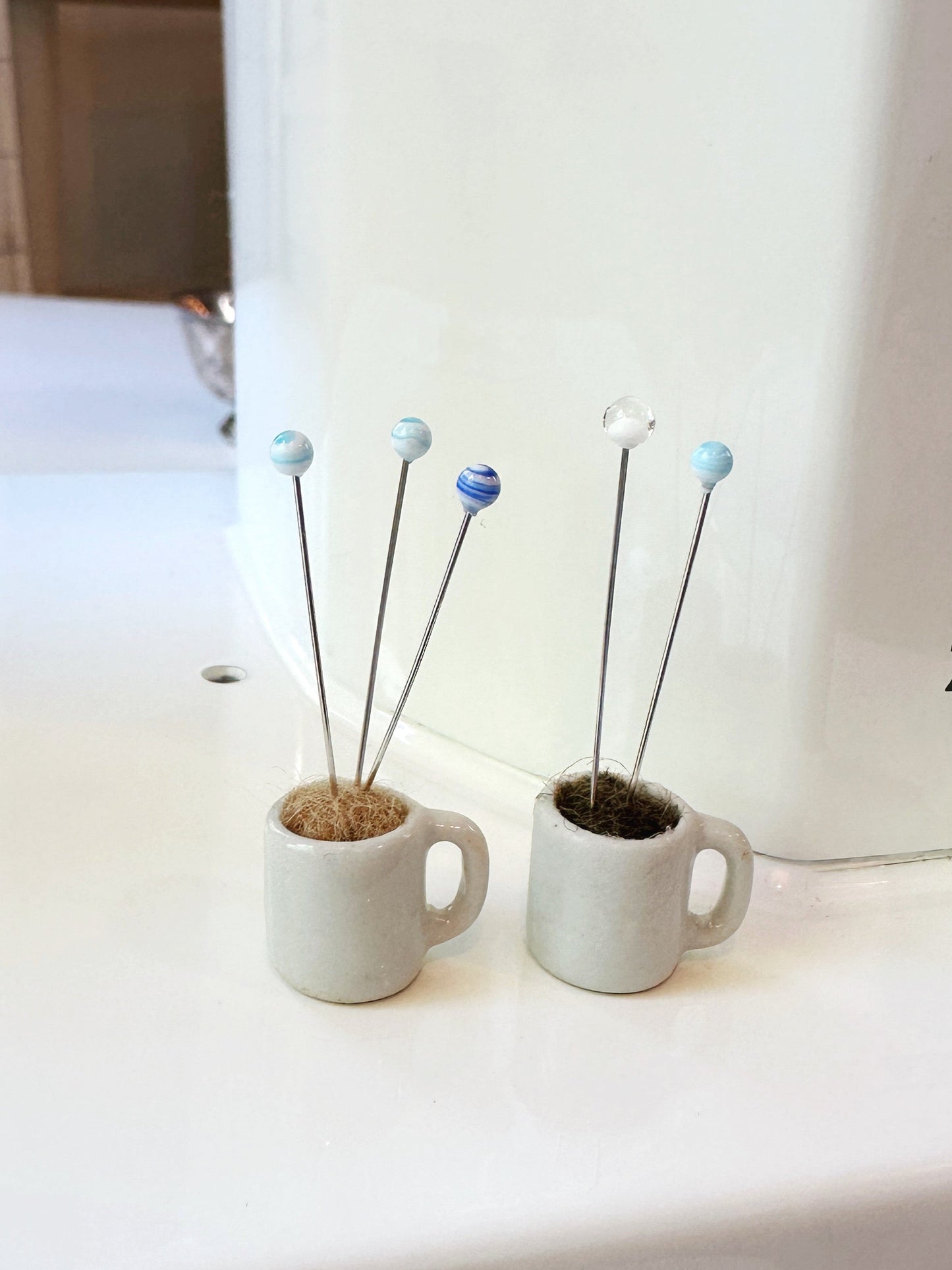 Coffee mug pin catcher