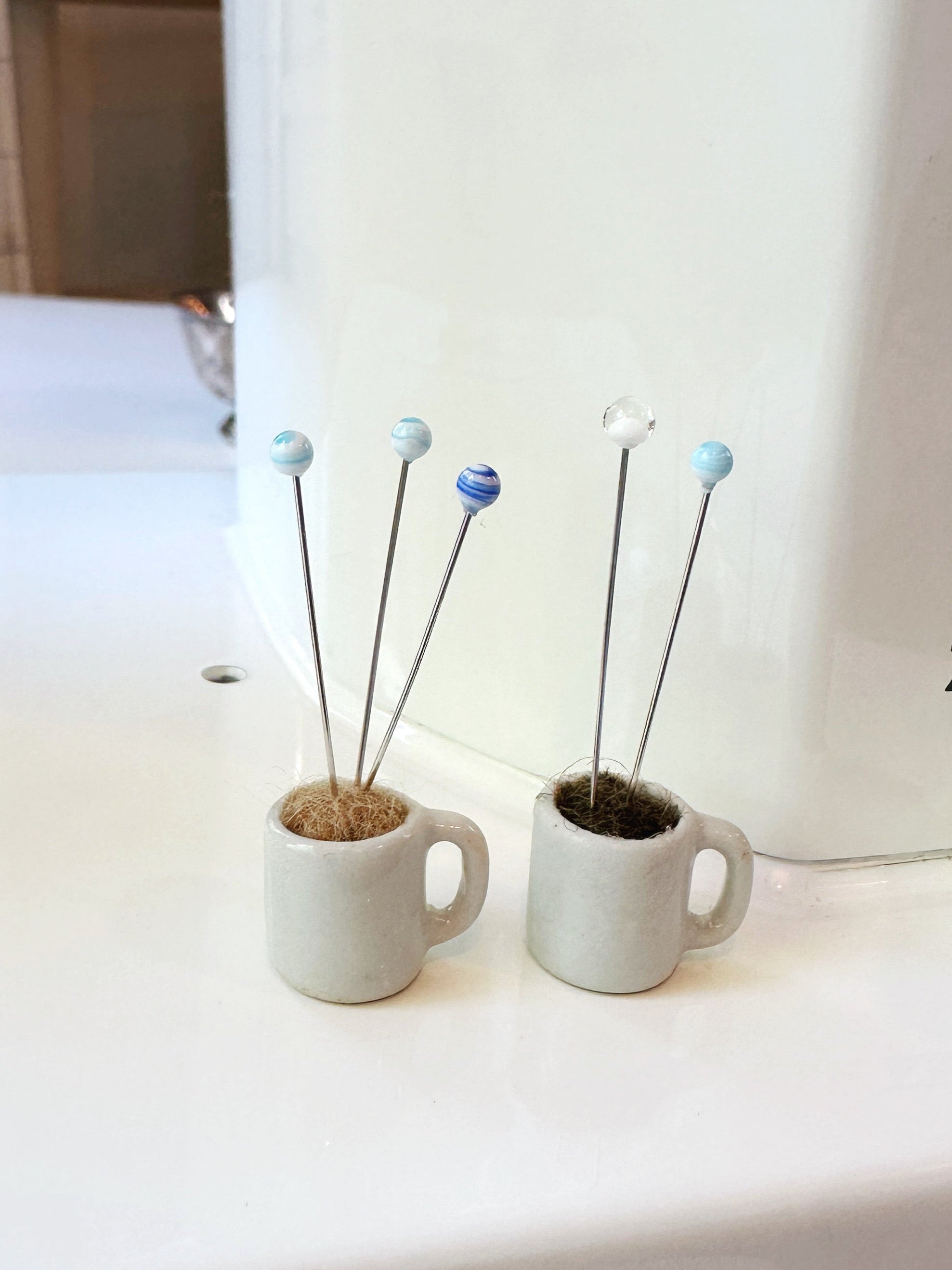 Coffee mug pin catcher