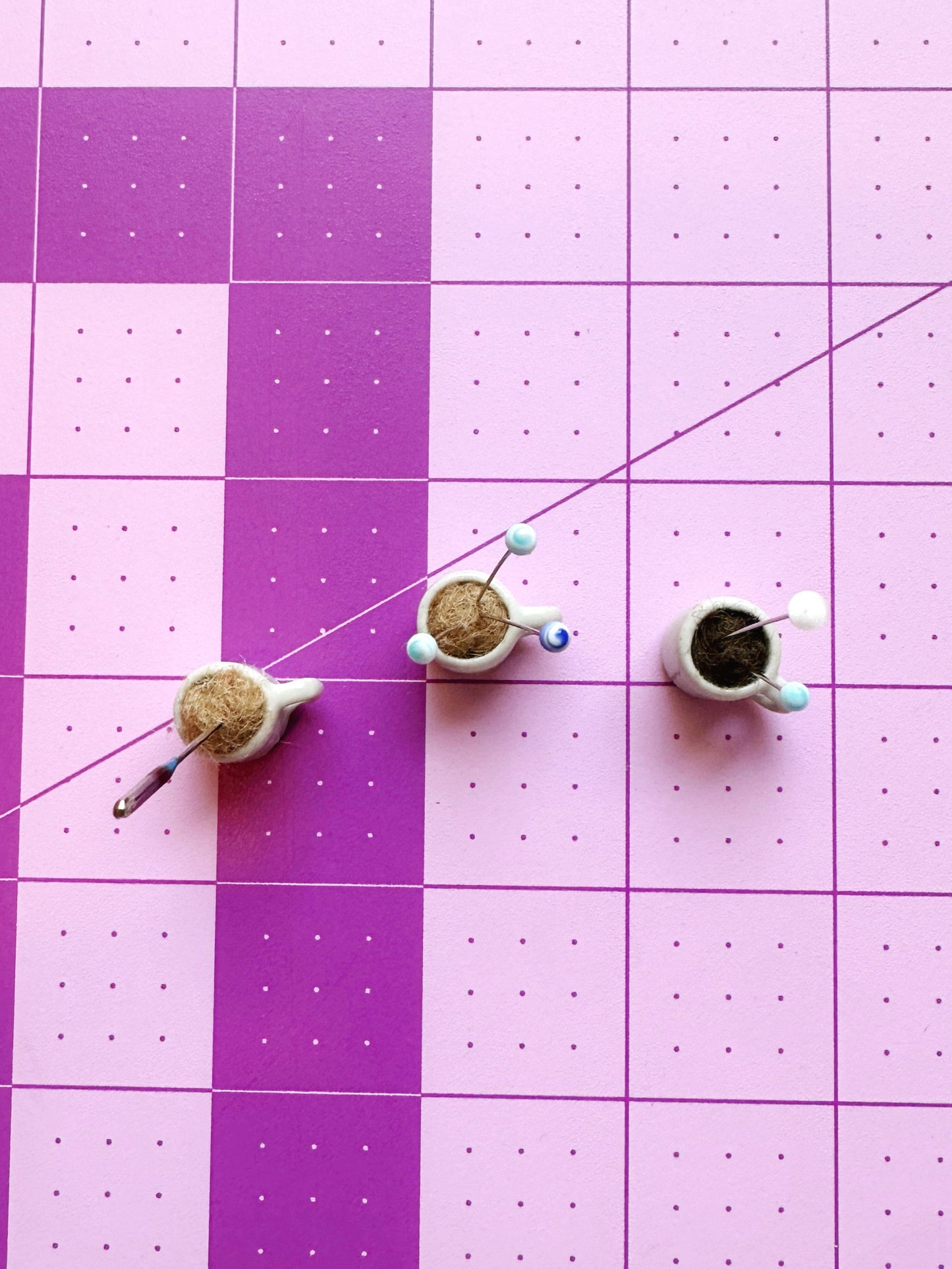 Coffee mug pin catcher