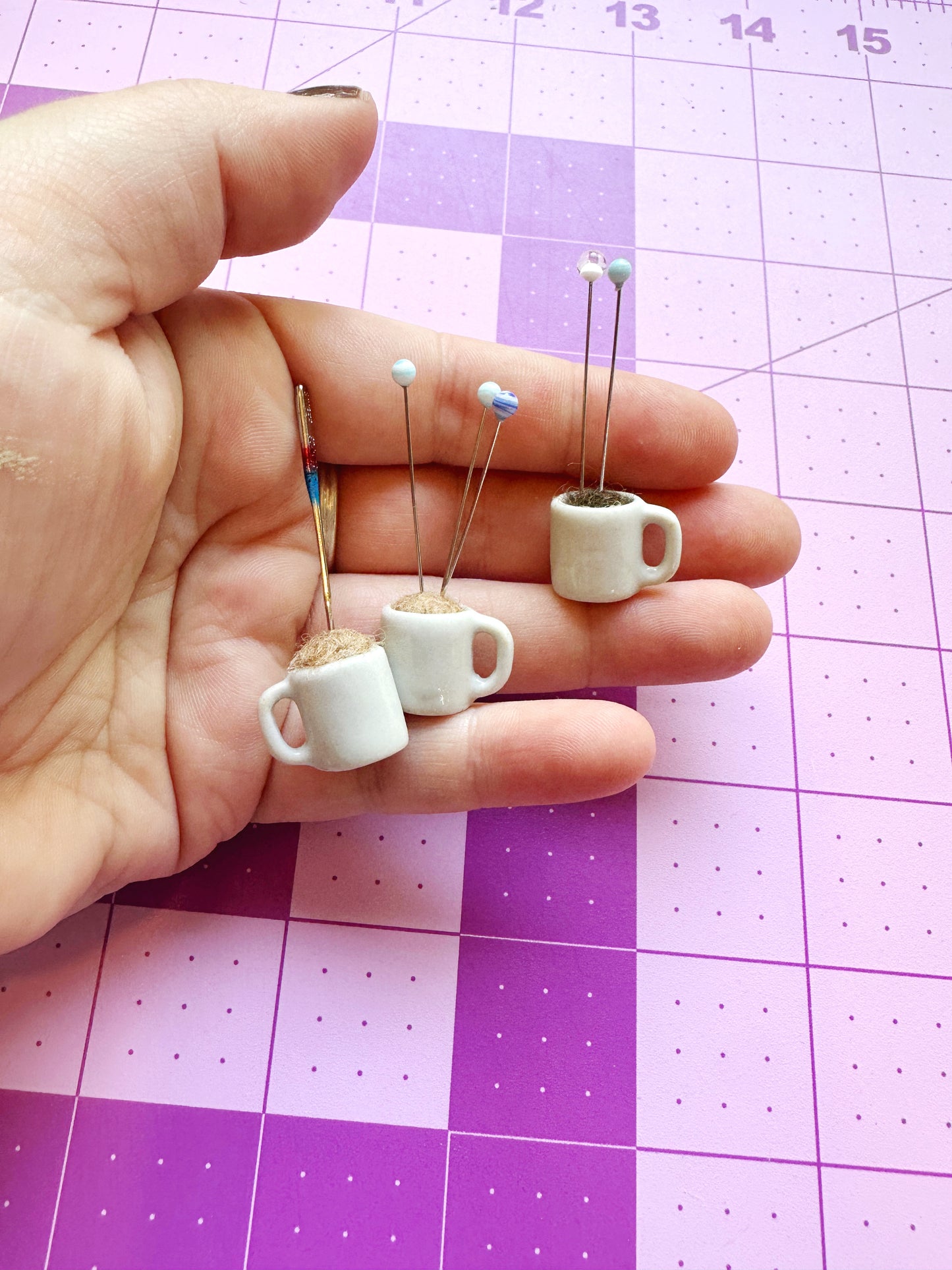 Coffee mug pin catcher