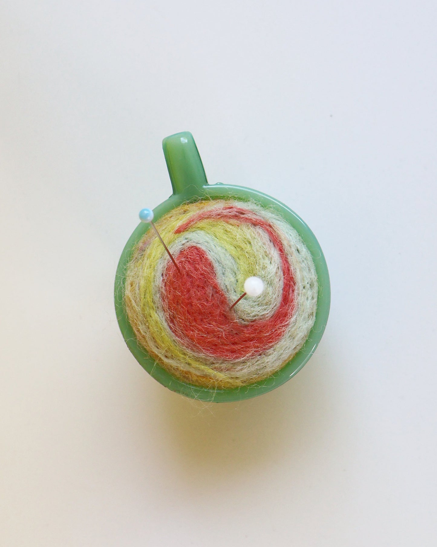 Marbled glass and wool pin cushion