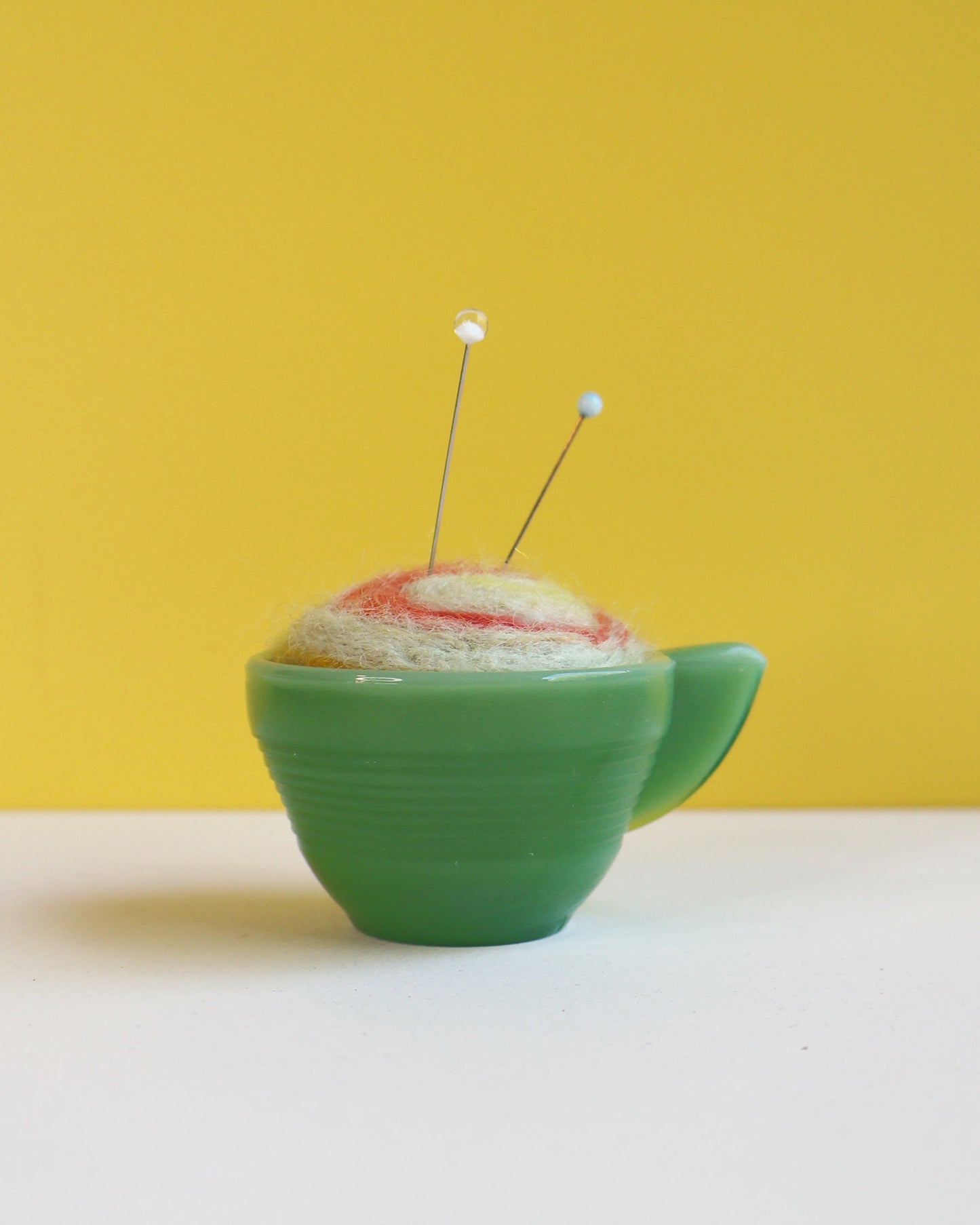 Marbled glass and wool pin cushion