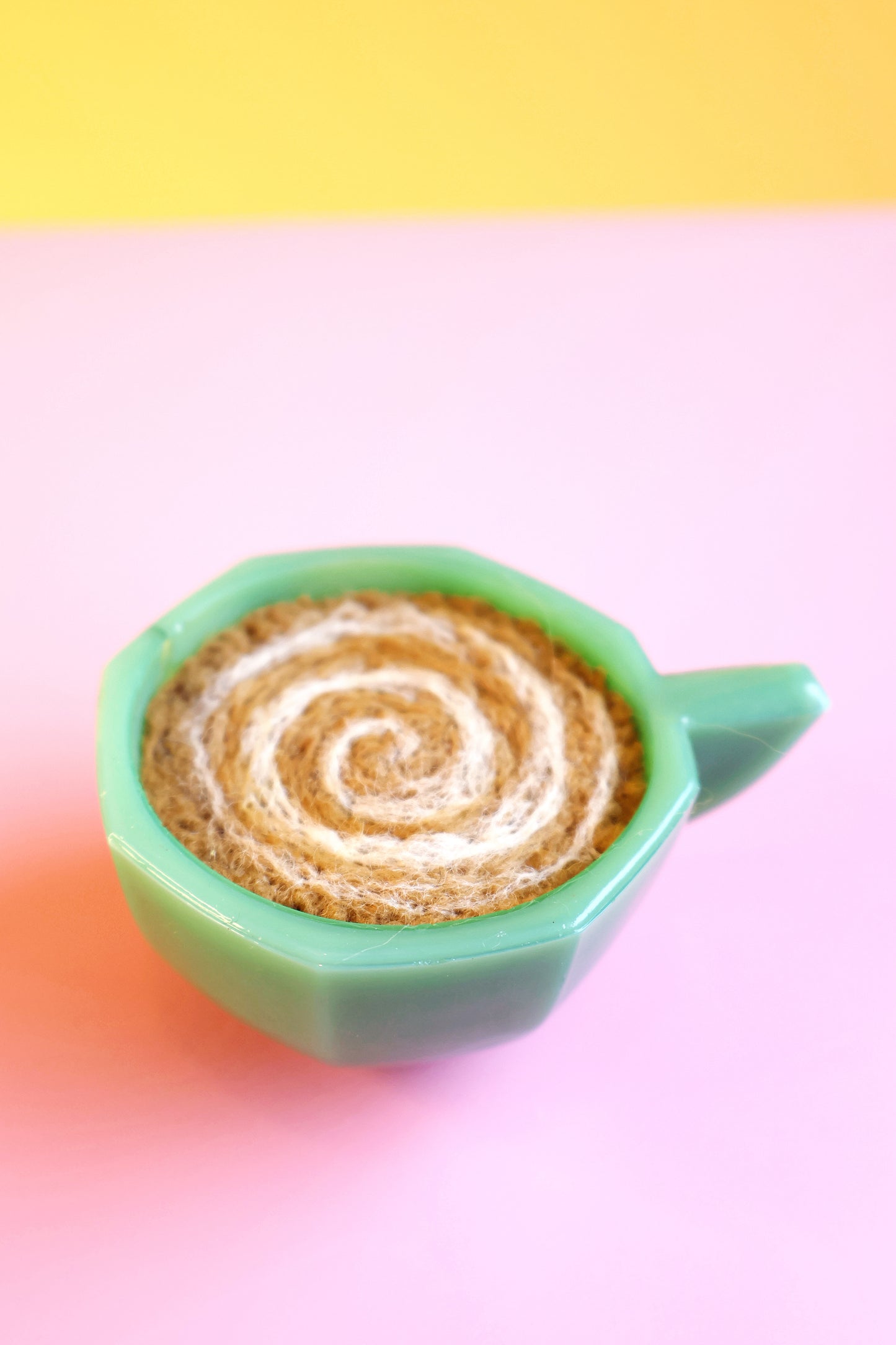 Green glass and wool teacup pin cushion