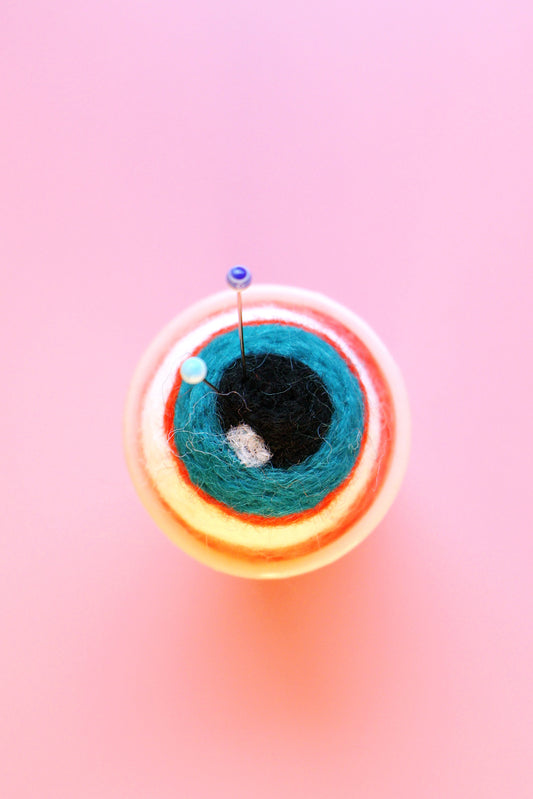 Eyeball glass and wool pin cushion