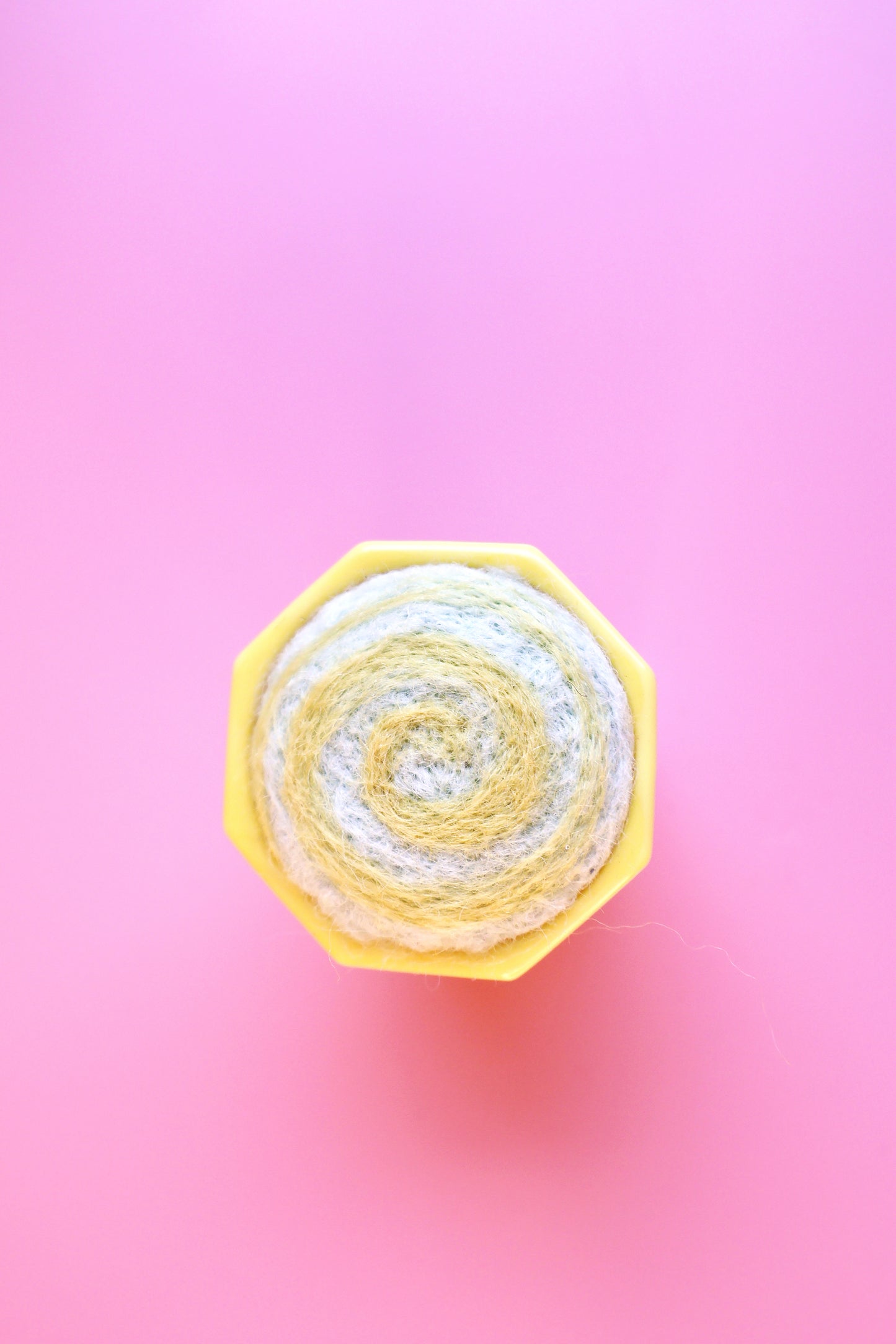 Yellow glass and wool pin cushion