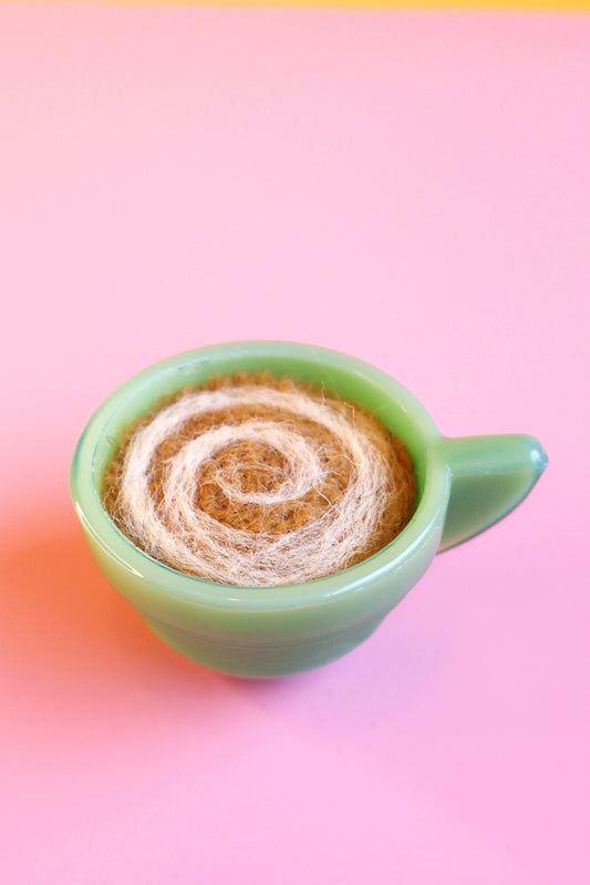 Green glass and wool teacup pin cushion