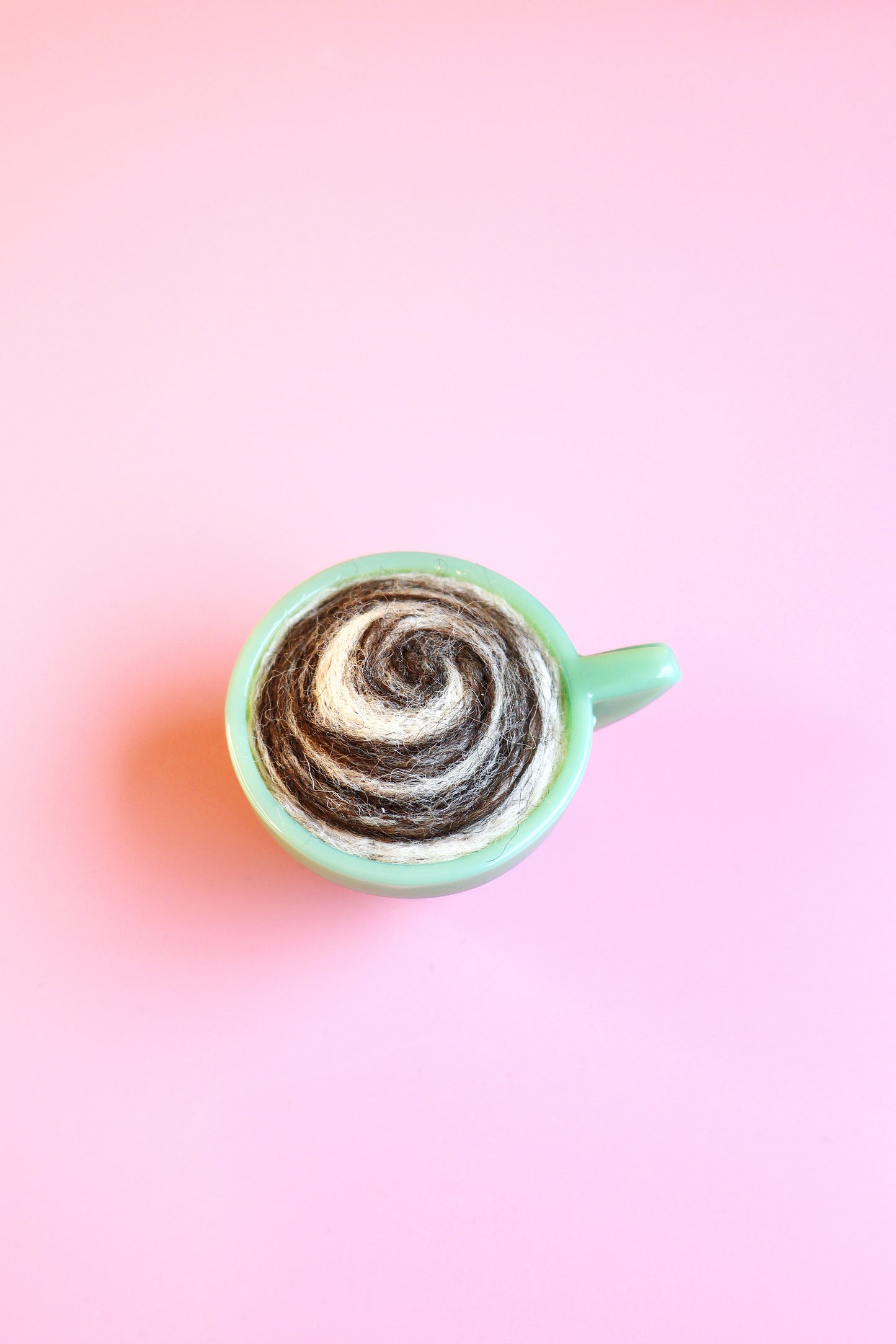 Green glass and wool teacup pin cushion